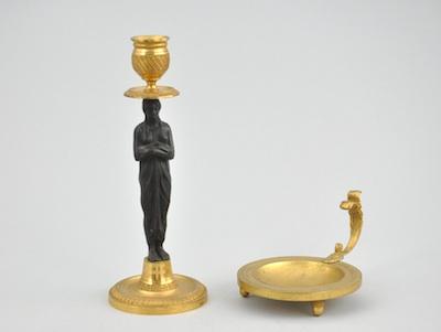 Appraisal: A Figural Ormolu and Patinated Bronze Candlestick and Burner With