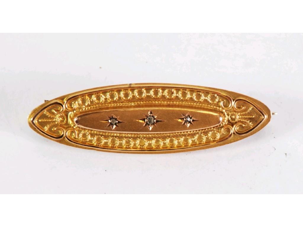 Appraisal: ct GOLD LOZENGE SHAPED BROOCH set with three tiny diamonds