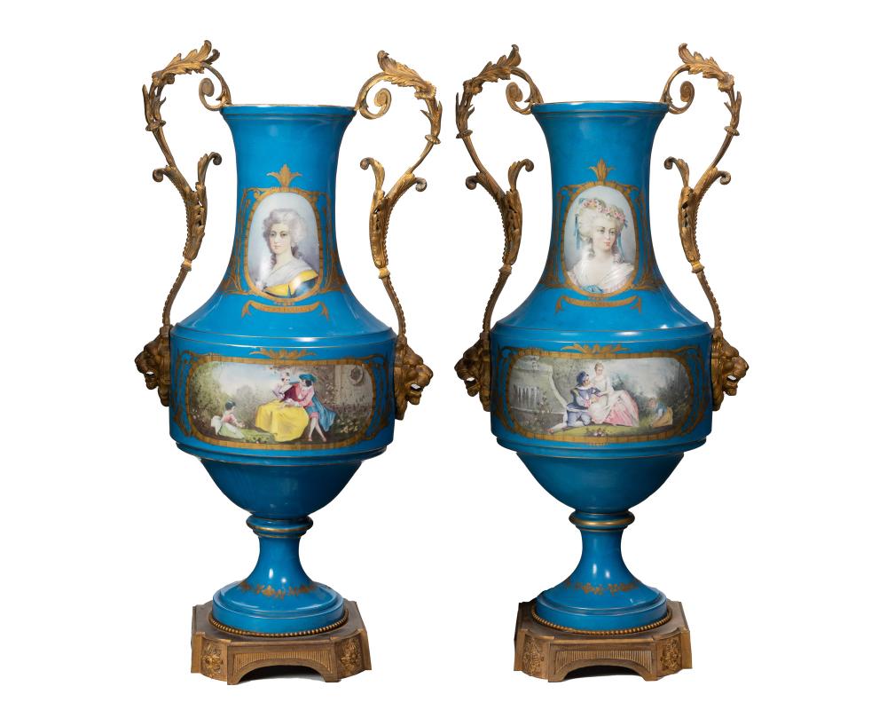 Appraisal: A pair of S vres-style porcelain urns Late th early