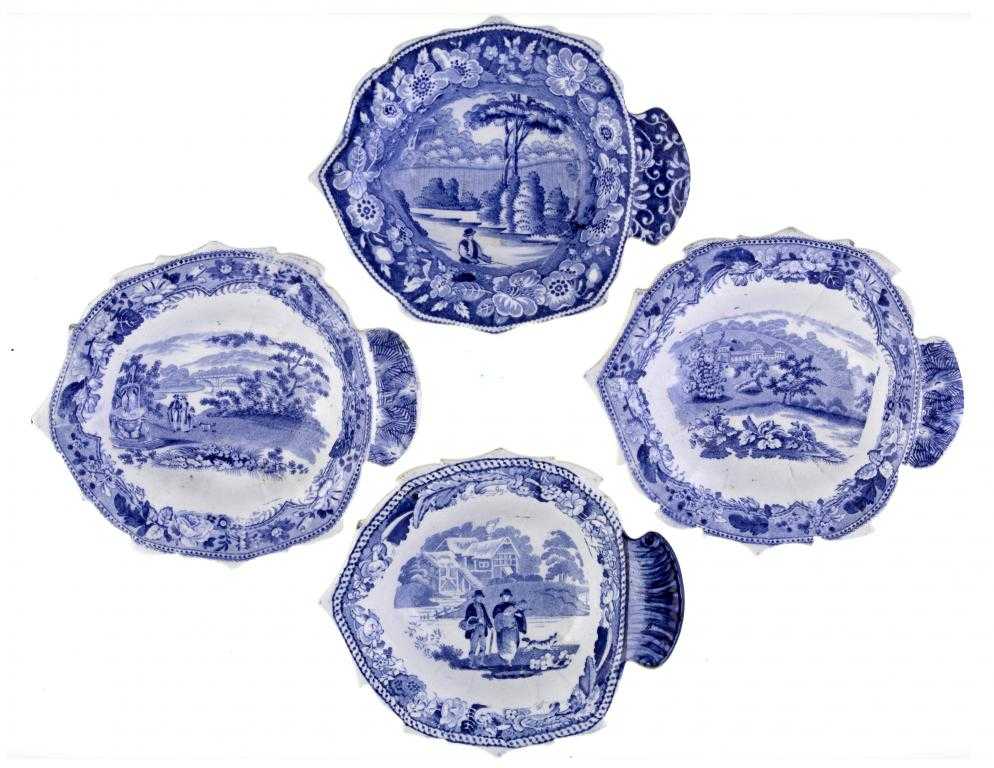 Appraisal: FOUR BLUE PRINTED EARTHENWARE PICKLE DISHES of leaf shape The