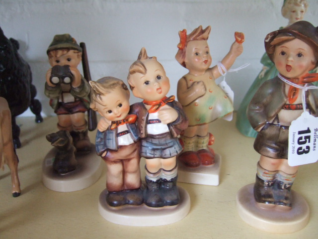 Appraisal: Four Hummel figures including a little hunter and three others