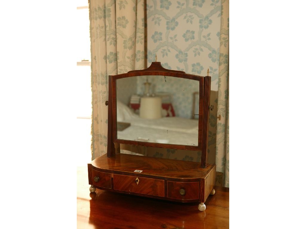 Appraisal: A REGENCY MAHOGANY DRESSING MIRROR with an arched rectangular plate