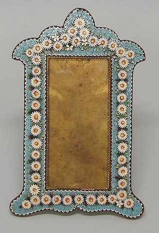 Appraisal: Shield form with flowers on blue ground oblong opening gilt