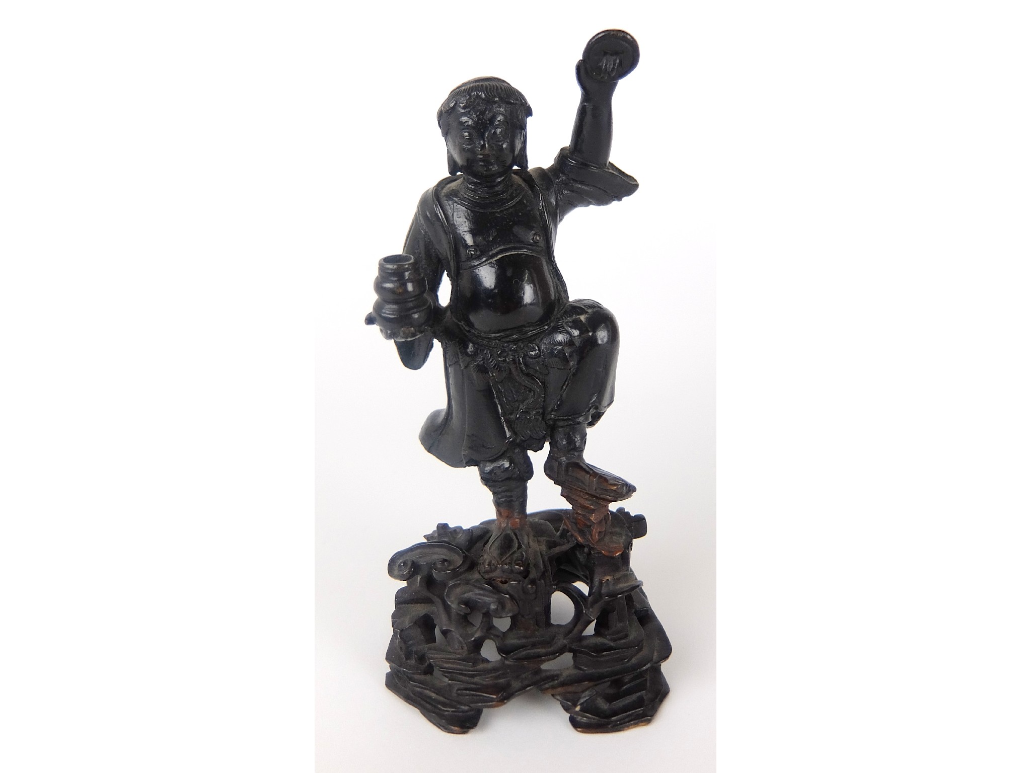 Appraisal: A Chinese bronze figure of a manstanding with a vase