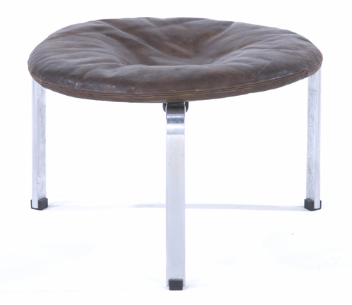 Appraisal: POUL KJAERHOLM Three-legged stool ottoman in brown leather on brushed