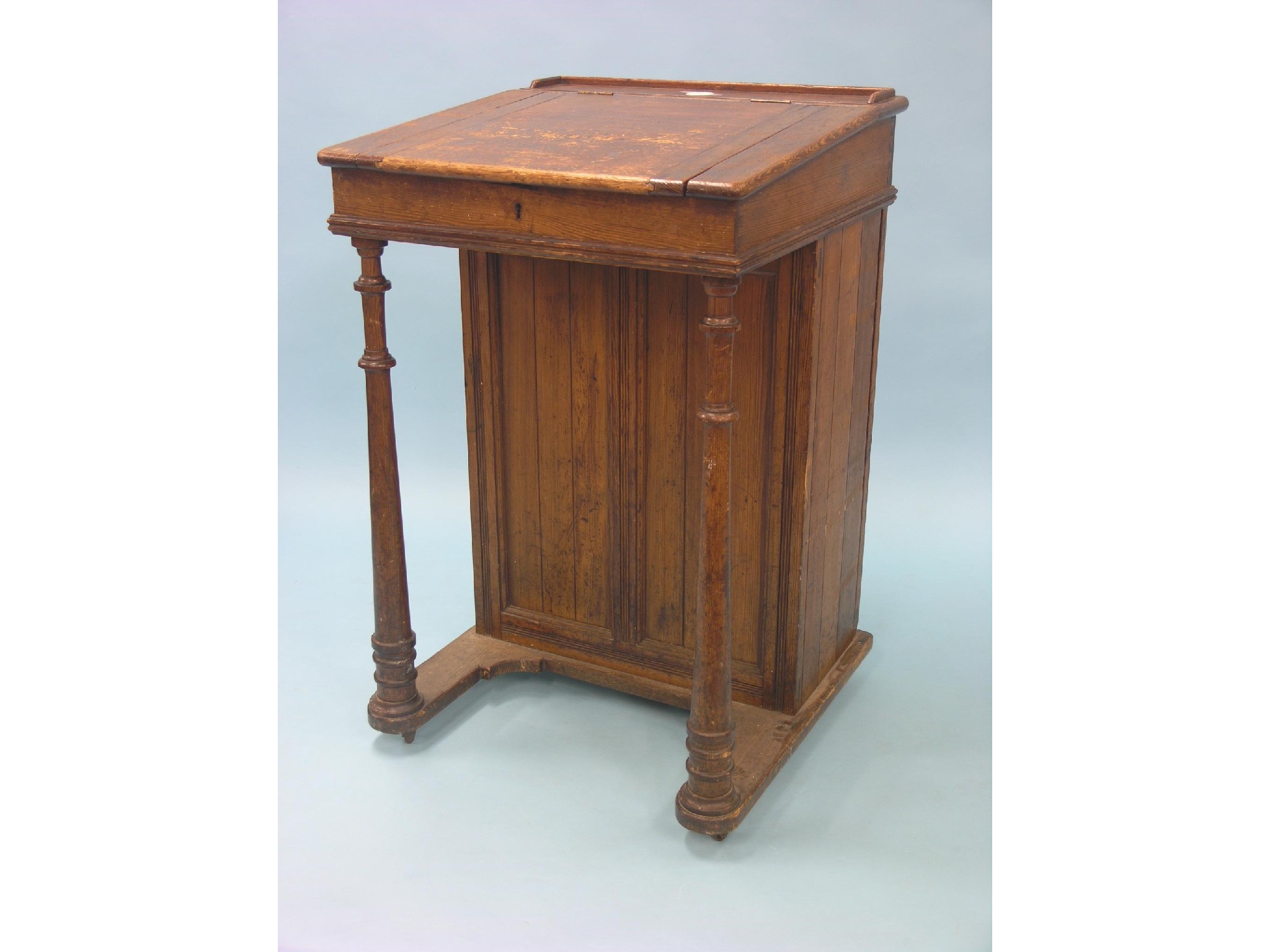 Appraisal: A Victorian stained pine clerk's desk sloping top with enclosed