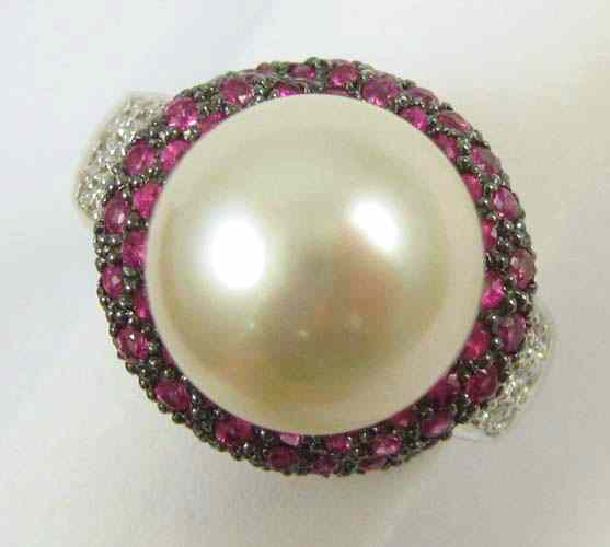 Appraisal: PEARL RUBY AND DIAMOND RING The k white gold ring