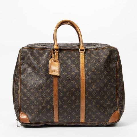 Appraisal: Louis Vuitton Sirius suitcase in monogram coated canvas with brass