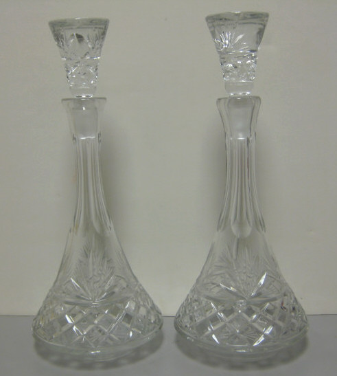 Appraisal: PAIR OF CUT GLASS DECANTERS Tall with large tapering stoppers