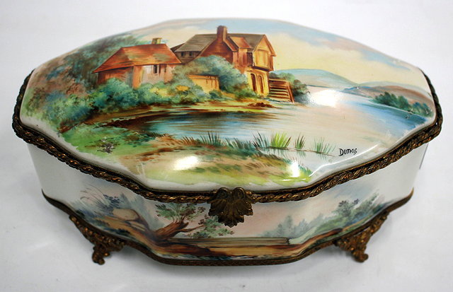 Appraisal: A PORCELAIN TABLE BOX with gilt metal mounts shaped oval