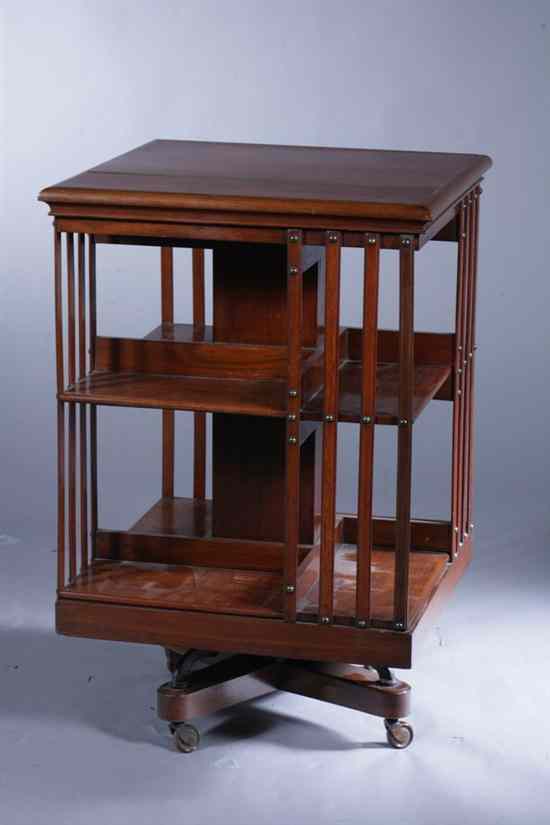 Appraisal: MAHOGANY SQUARE-SIDED TWO-SHELF REVOLVING BOOKCASE early th century Two compartmented