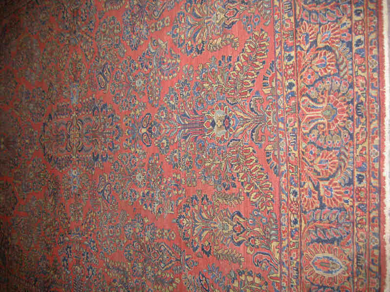 Appraisal: SAROUK ROOM RUG The red field shows an allover pattern