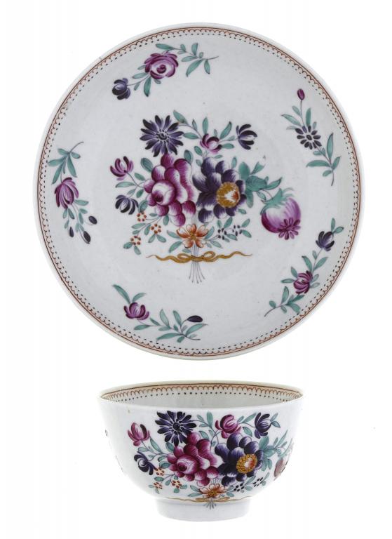 Appraisal: A FIRST PERIOD WORCESTER TEA BOWL AND SAUCER enamelled in