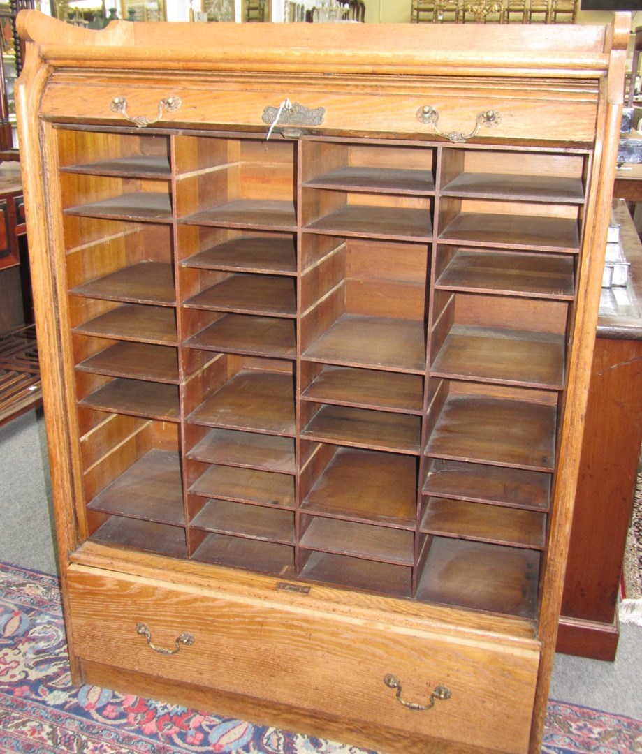 Appraisal: An early th century American tambor fronted oak filing cabinet