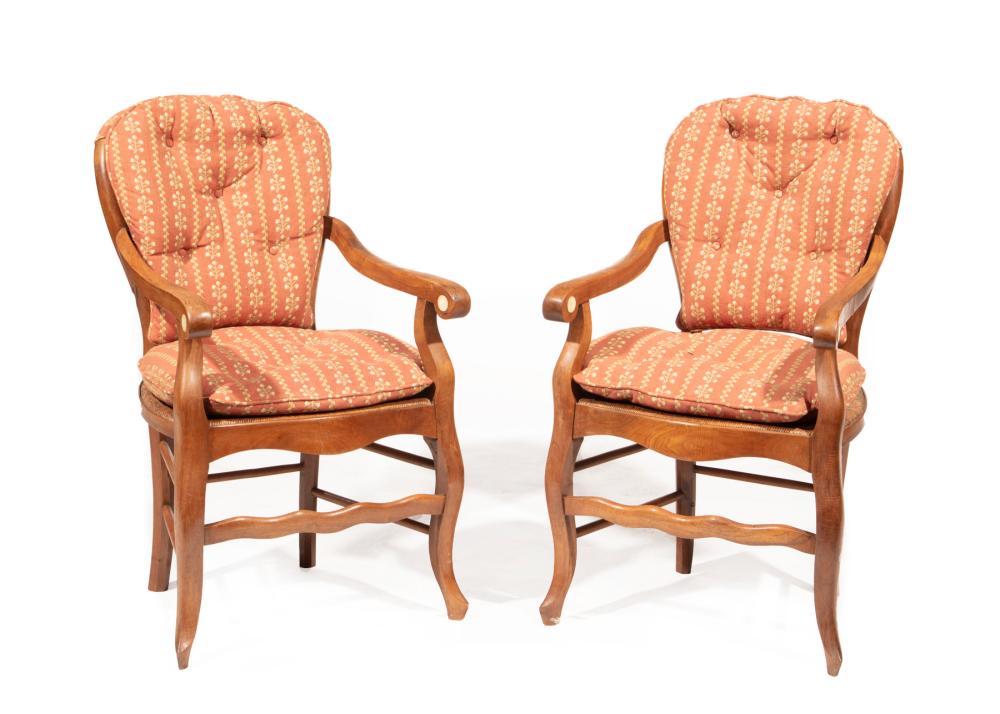 Appraisal: PAIR OF FRENCH PROVINCIAL CARVED FRUITWOOD FAUTEUILSPair of French Provincial