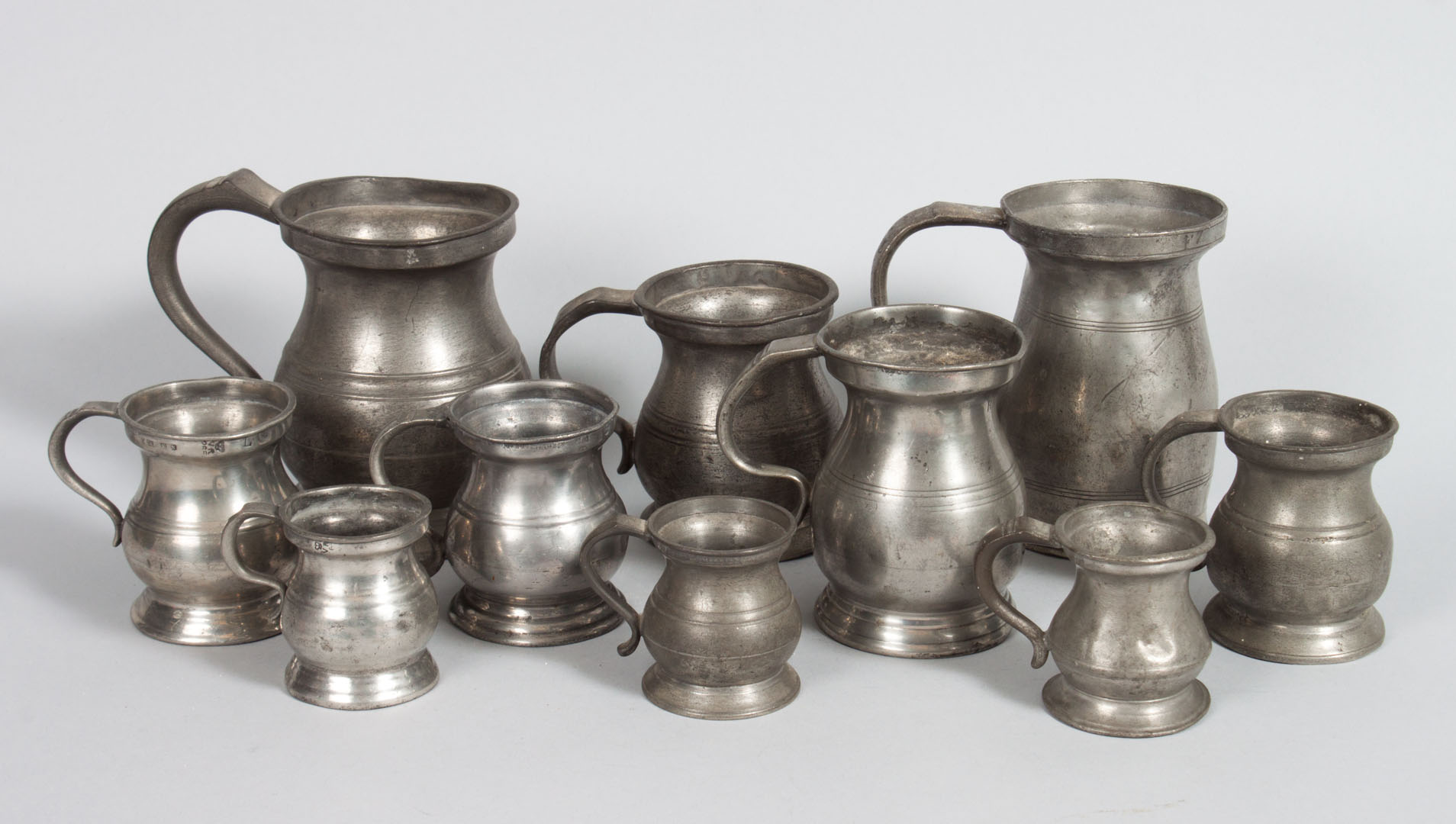 Appraisal: Set of pewter measures th century assembled set comprising English