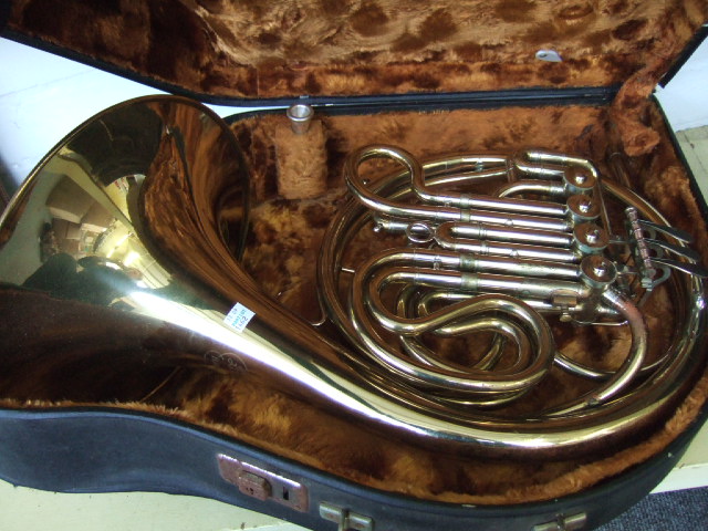 Appraisal: A gilt brass French horn by BRNO with furr lined