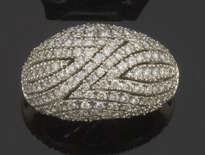 Appraisal: A diamond bombe cluster ring Set with lines of brilliant