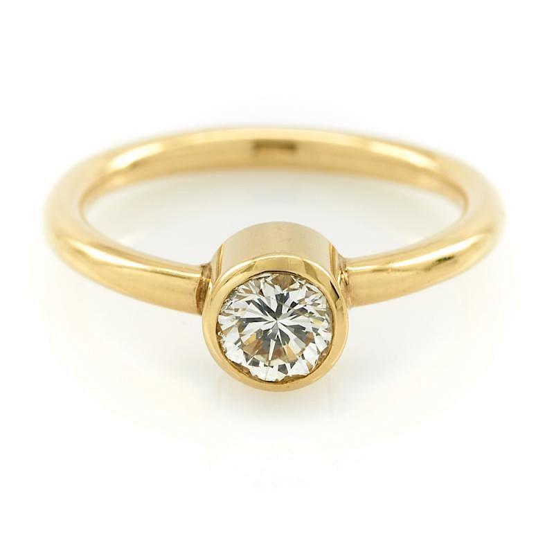 Appraisal: k Yellow gold and bezel set diamond ring k Yellow