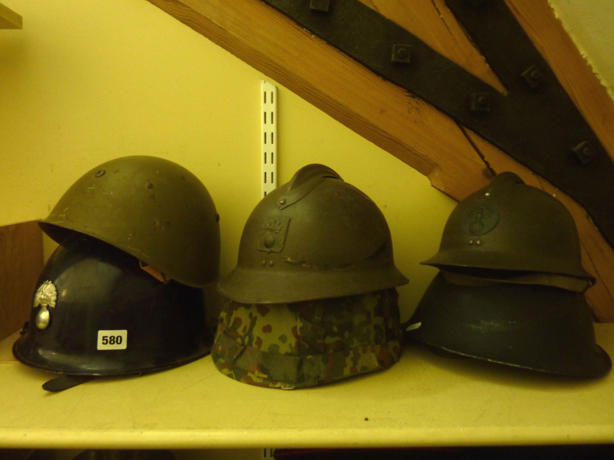 Appraisal: Six various th century military helmets to include an example