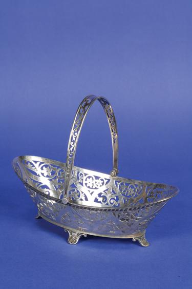 Appraisal: AN EDWARDIAN BASKET of shaped oval form the body and