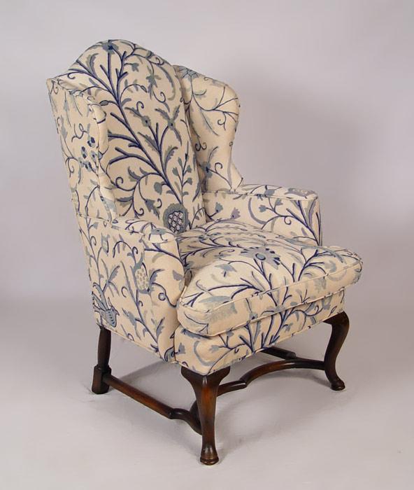 Appraisal: EARLY WINGBACK CHAIR UPHOLSTERED IN CREWEL EMBROIDERY Sold with extra