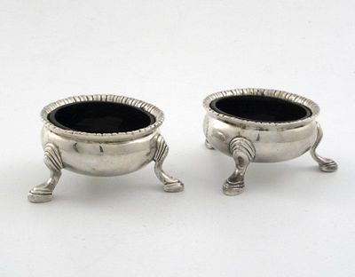 Appraisal: A pair of Edwardian Irish salts on three feet with