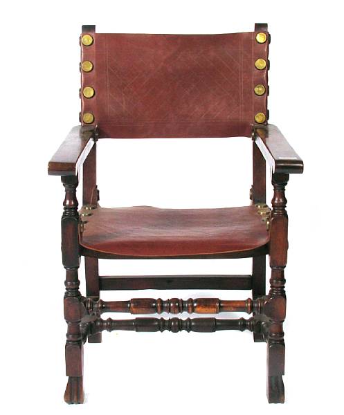 Appraisal: A Spanish Baroque style walnut and leather armchair height in