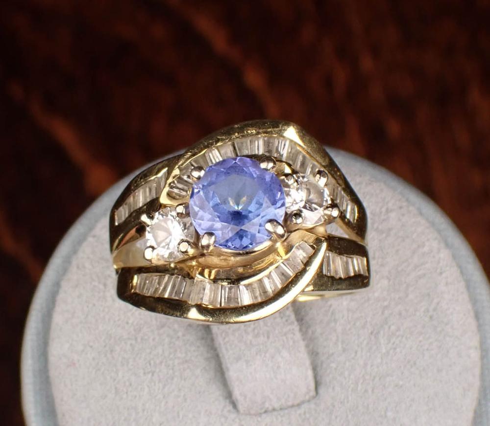 Appraisal: TANZANITE DIAMOND AND FOURTEEN KARAT GOLD RING The yellow gold