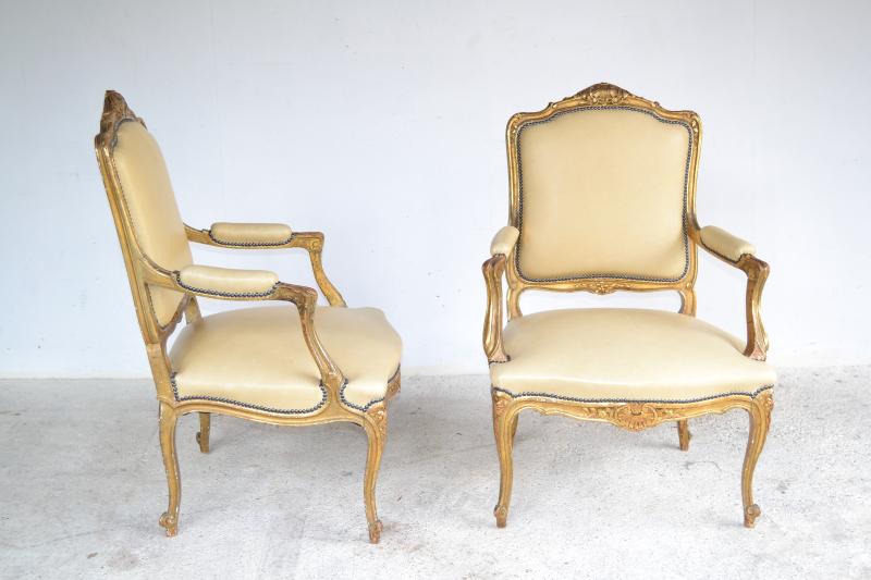 Appraisal: TWO FINE LOUIS XV STYLE GILT FAUTEUILS IN CREAM LEATHER