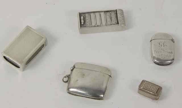 Appraisal: Four silver vesta cases and a vinaigrette