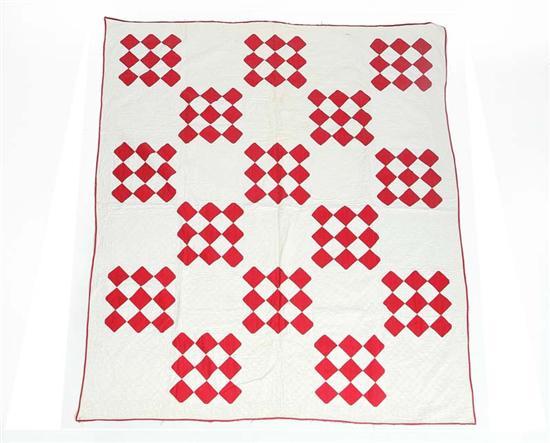 Appraisal: PIECED QUILT White ground with squares of nine red diamonds