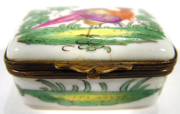 Appraisal: Rectangular porcelain pillbox and cover with enamelled decoration depicting a