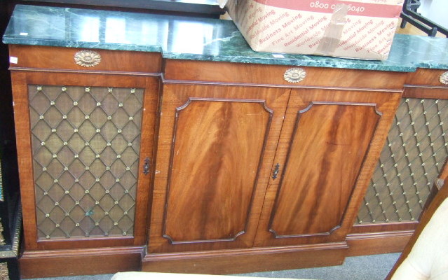 Appraisal: A Regency style breakfront side cabinet the marble top over