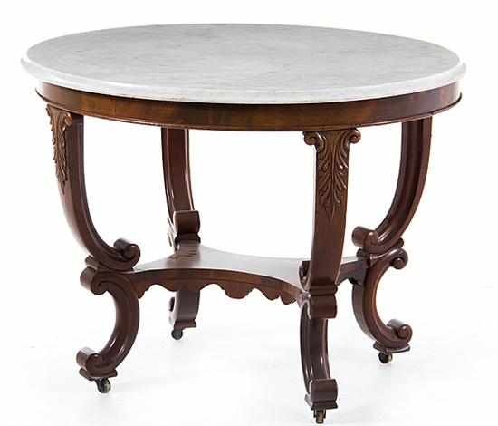 Appraisal: Victorian carved mahogany marbletop center table late th century white