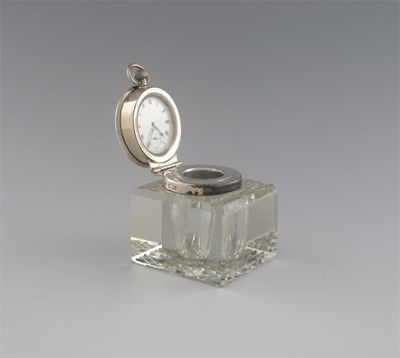 Appraisal: A modern mounted square glass inkwell with a hinged cover