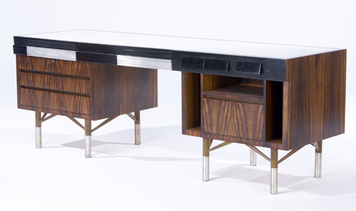 Appraisal: PAUL LASZLO Rosewood veneer desk with eleven drawers and white