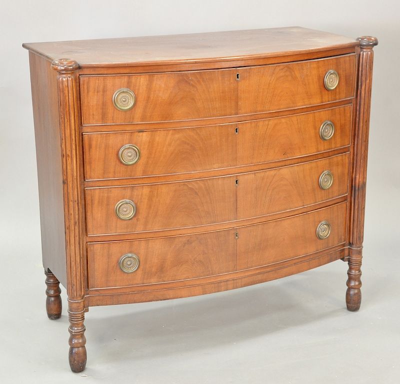 Appraisal: Four drawer Sheraton bow front chest with turret corners circa