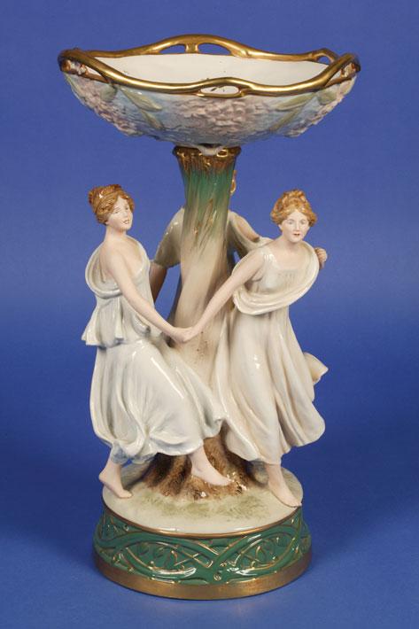 Appraisal: A ROYAL DUX TABLE CENTREPIECE modelled as the Three Graces