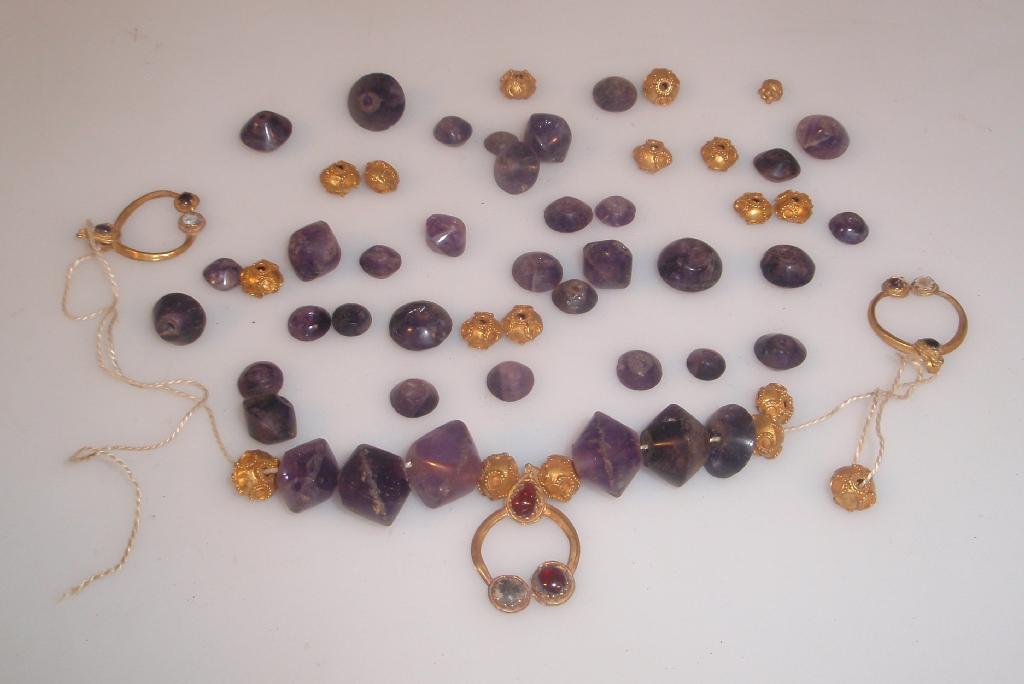 Appraisal: A Roman necklace comprising thirty-seven graduated bi-conical cut amethyst beads