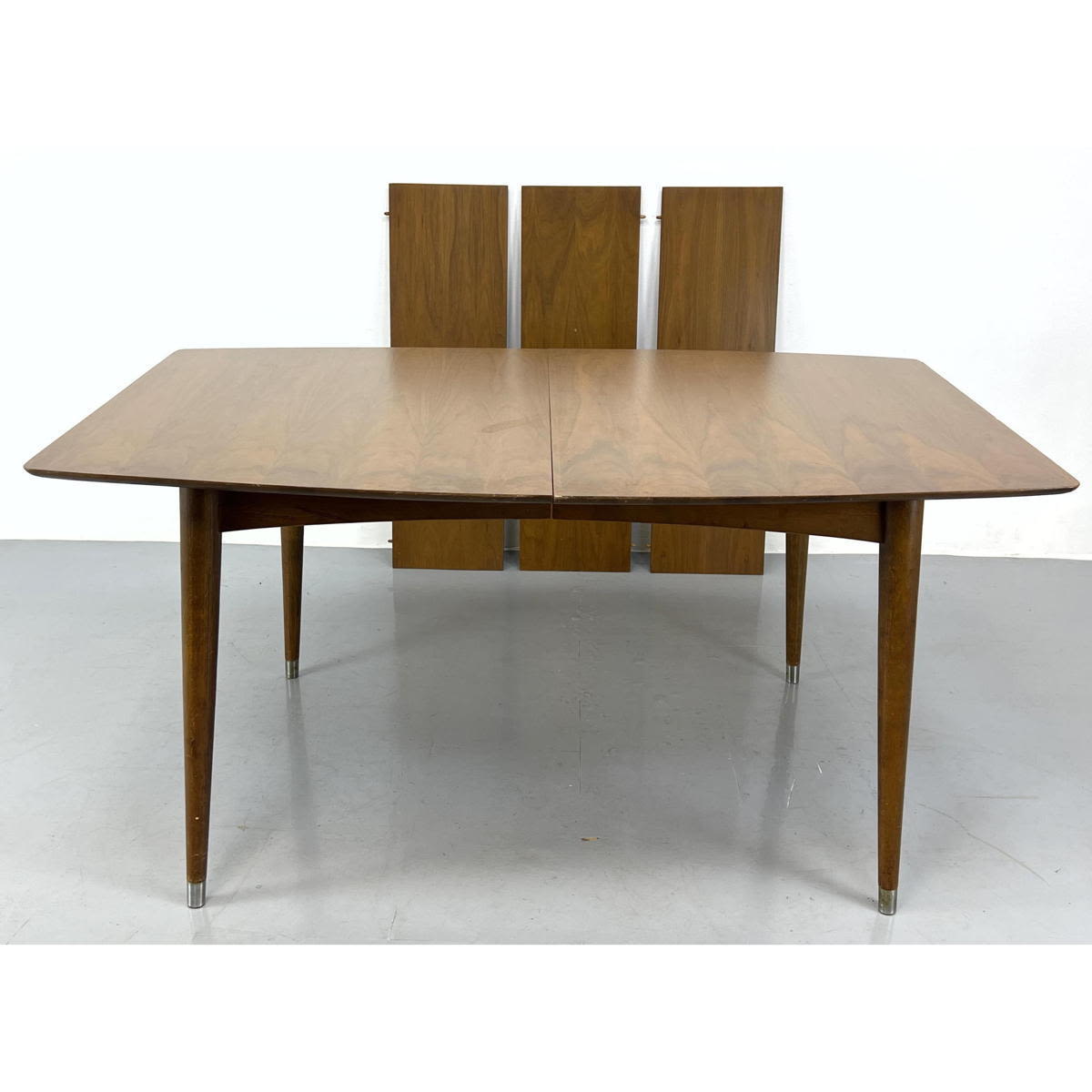 Appraisal: American Modern Walnut Dining table with leaves Includes - inch