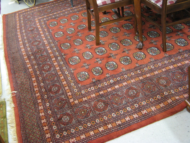 Appraisal: RED FIELD BOKHARA CARPET Pakistani Turkoman geometric Turkoman gol decoration