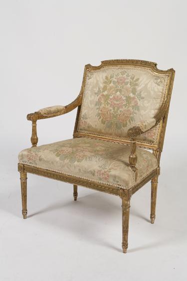 Appraisal: A LOUIS XVI GILT FRAMED ARMCHAIR the low shaped back