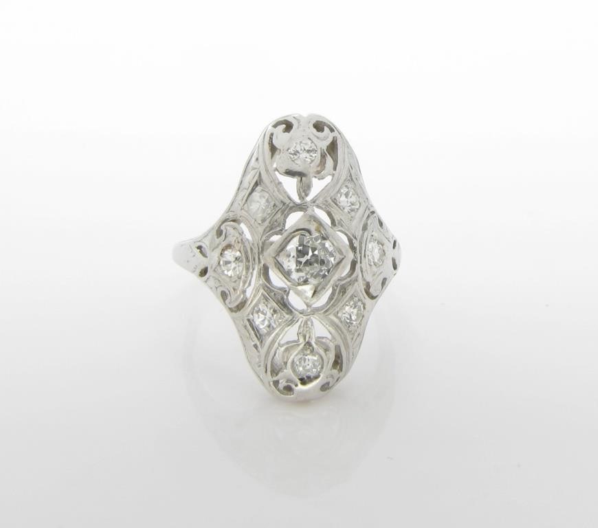 Appraisal: A K white gold vintage filigree style ring with three