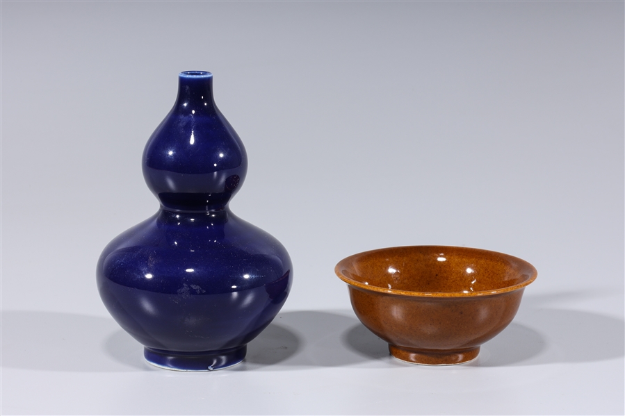 Appraisal: Two Chinese monochrome porcelains including brown glazed bowl and blue-glazed