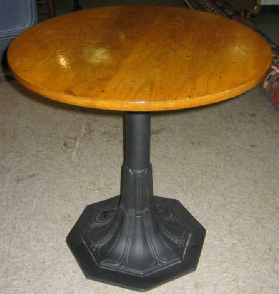 Appraisal: CAST IRON BASE PUB TABLE Wooden circular surface black painted