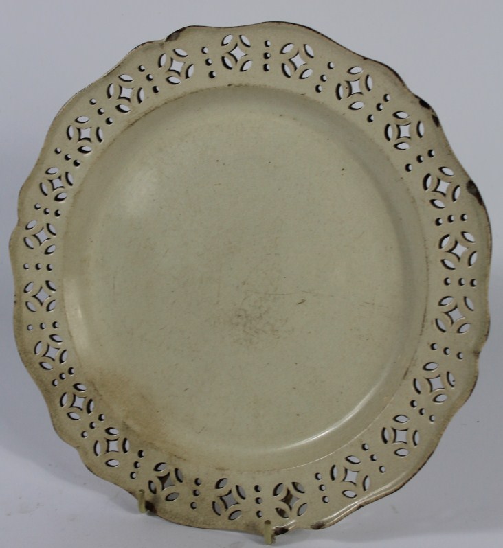 Appraisal: An early thC creamware plate with a pierced repeating border