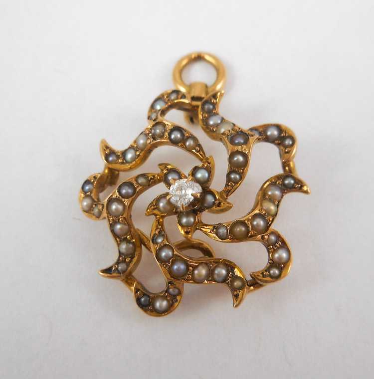 Appraisal: DIAMOND AND FOURTEEN KARAT GOLD PENDANT with seed pearls set