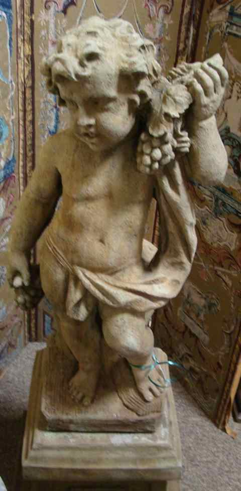 Appraisal: CAST STONE FIGURE OF AN ALLEGORICAL SPRING PUTTO