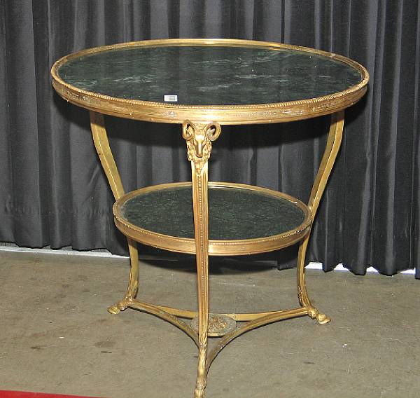 Appraisal: A pair of Louis XVI style gilt metal gueridons modern